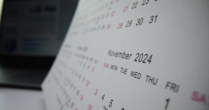 Closeup of white color calendar on table 2024