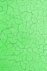 Cracked green background. Mockup of peeling surface. Phone wallpaper