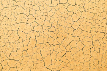Yellow cracked and peeling background. Mockup wallpaper