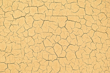 Yellow cracked and peeling texture background. Mockup wallpaper, copy space