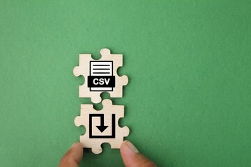 wooden puzzle with icon save csv format file. the concept of file management or DMS.
