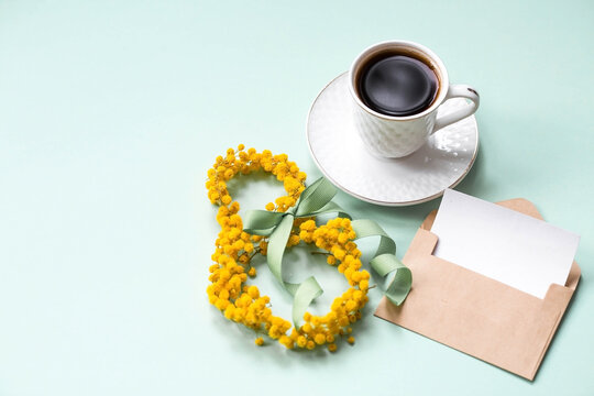 A banner, a flyer, a beautiful postcard for March 8th. Yellow mimosa flowers in the shape of the number eight and an envelope with a place for text on a turquoise, blue background.