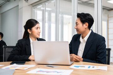 Asian business people team analyzing statistics financial. Team of businesspeople Meeting Conference Discussion Corporate Concept in office.