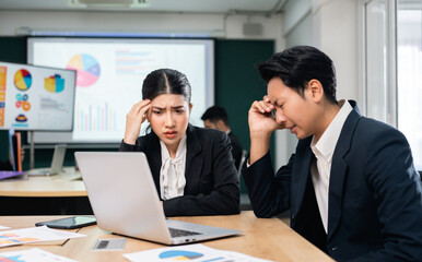 Asian business people team analyzing statistics financial. Team of businesspeople Meeting Conference Discussion Corporate Concept in office.