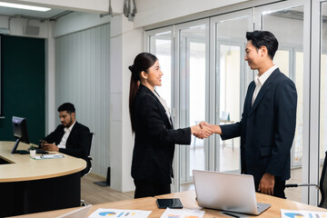 Asian business people team analyzing statistics financial. Team of businesspeople Meeting Conference Discussion Corporate Concept in office.