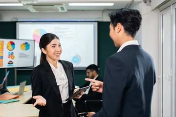 Asian business people team analyzing statistics financial. Team of businesspeople Meeting Conference Discussion Corporate Concept in office.