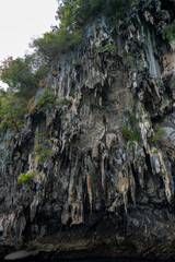 Granite marble rock structure surface of natural mountain's cliff and cave., travel to the beautiful sea for tourists Snorkeling in Andaman Sea, Koh Waen, Koh Chueak, Trang Province, Thailand