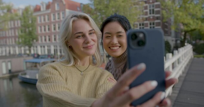 Lesbian Couple Taking Selfie on City break In Amsterdam, the Netherlands