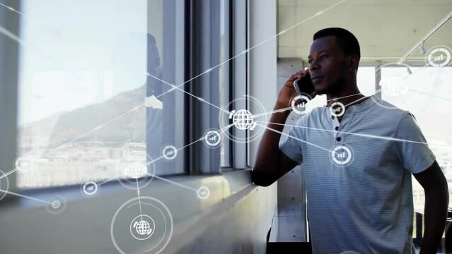 Animation of network of connections over african american man talking on smartphone