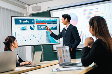 Asian business people team analyzing statistics financial. Team of businesspeople Meeting Conference Discussion Corporate Concept in office.