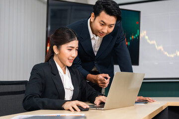 Asian business people team analyzing statistics financial. Team of businesspeople Meeting Conference Discussion Corporate Concept in office.