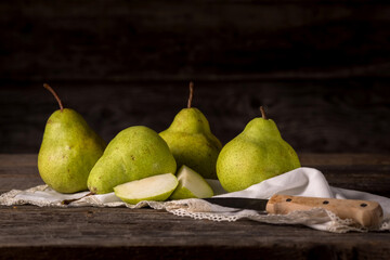 Still life of green pears in rustic style