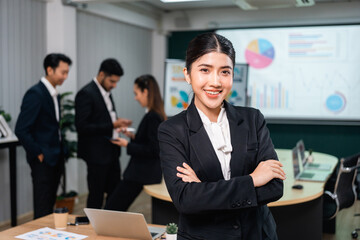 Asian business people team analyzing statistics financial. Team of businesspeople Meeting Conference Discussion Corporate Concept in office.