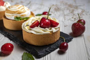 Close up of sweet mini tartlet with cherry.Dessert mini cake