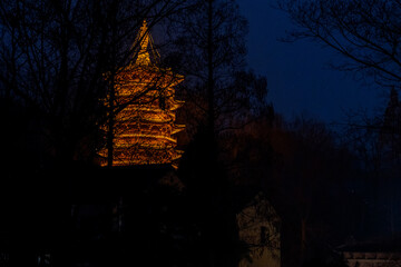 Lighted pagoda at night