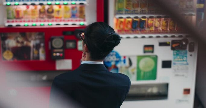 Vending machine, business man and thinking of choice or decision of automatic service on digital tech at night in city outdoor. Back, shopping and professional customer in urban town in Tokyo Japan