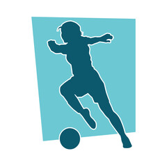 Silhouette of a female soccer player kicking a ball. Silhouette of a football player woman in action pose.