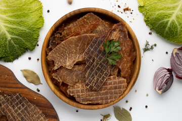 Pieces of dried meat with ingredients and salad.Flat lay.American food