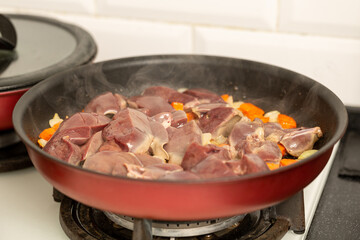 Roasting turkey liver with vegetables, making pate