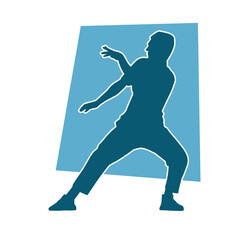Silhouette of a slim male in dance pose. Silhouette of a man dancing.