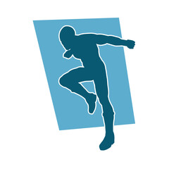 Silhouette of a man in oriental martial art pose. Silhouette of a male in martial art move.