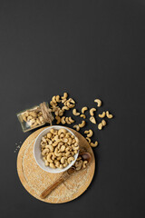 Cashew nuts on a grey background.Copy space.Vertical format
