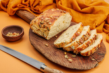 Fresh bread with pumpkin seeds. Home baking concept. Autumn decor