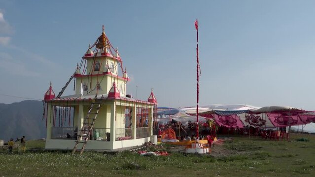 June 28th 2023 Uttarakhand, India. A Decorated Hindu temple dedicated to Naag Devta ( Serpent God) during a religious ceremony with people performing Hawan ( An Indian Hindu religious Practice).