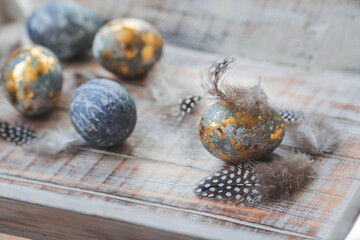 Happy Easter 2024. Stylish grey Easter eggs in the color of marble, concrete, gold and beautiful...
