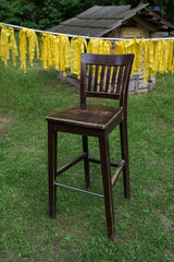 Wooden chair on meadow