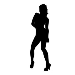 Silhouette of a young slim female model in tight outfit. Silhouette of a slim woman in feminine pose.