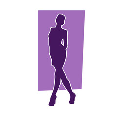 Silhouette of a young slim female model in tight outfit. Silhouette of a slim woman in feminine pose.