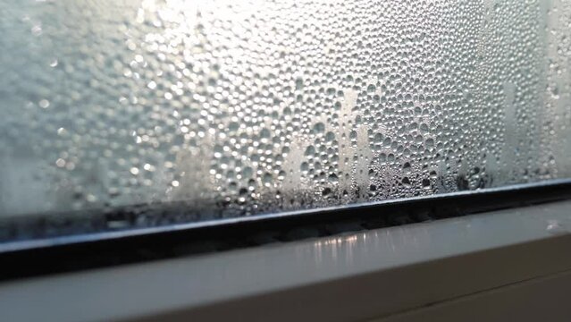 condensation on glass of metal-plastic windows