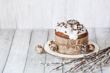 Stylish grey Easter eggs in the colors of marble, concrete, willow branches, Easter chicken and Easter cake on a white wooden background. Coloring eggs for Easter. The feast of bright Easter.