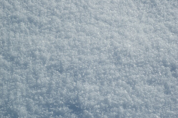Fototapeta premium Winter snow. Snow texture background. Top view of the snow. Texture for design. Snowy white texture. Snowflakes.