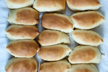 Top view of fresh homemade golden brown pies © Volodymyr