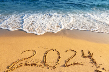 2024 inscription on sandy beach