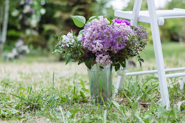 Lilac Elegance: Floral Arrangement in a Small Bucket, a Charming Decorative Element. - 706327800