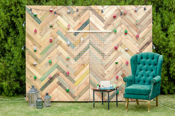 Beautiful display wall for a wedding featuring a chevron pattern made with reclaimed wood as a...
