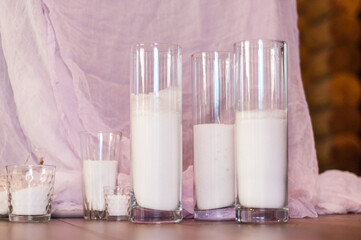 wax candles in glass vases as a wedding decoration.