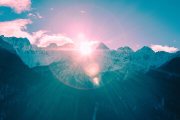 The tops of the mountains are covered with snow. View of Alps in Kranjska Gora at sunrise. Triglav...