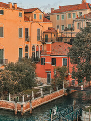 Fototapeta na wymiar Old traditional pastel colored buildings in Venice, Italy by the Grand Canal
