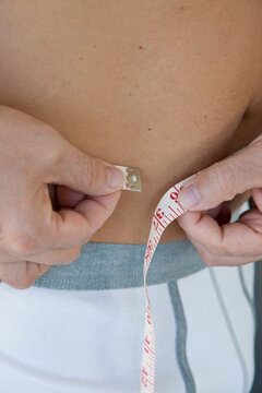 Close up of Man Measuring Waist
