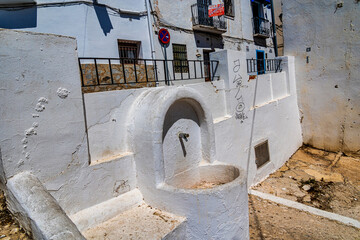 urban narrow street in the Spanish city of Altea on a summer day