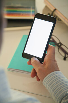 Man Holding White Blank Screen Smartphone
