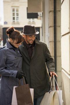 Young couple window shopping
