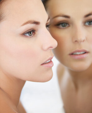 Profile of Woman Face and Mirror Image
