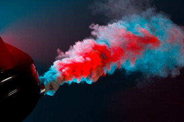 Vibrant Red and Blue Exhaust Smoke Billowing from Sports Car Tailpipe