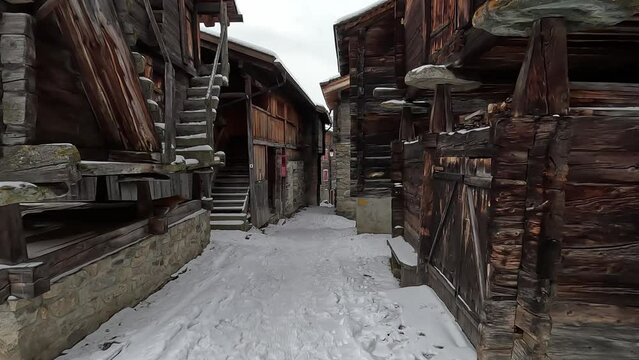 The old village of Bellwald in Switzerland. Old huts and snow-covered alleyways