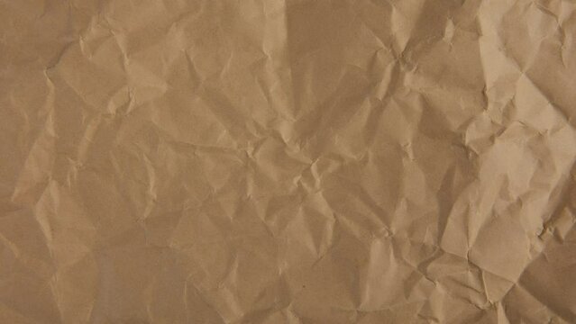 Stop motion of brown crumpled paper texture background